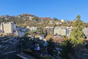 a view of a city with buildings and a street at Le Royat Palace #Therme#Confort - Meublé classé 3étoiles in Royat
