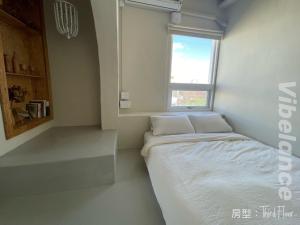 Postel nebo postele na pokoji v ubytování 春色領地 Vibelance inn