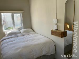 Postel nebo postele na pokoji v ubytování 春色領地 Vibelance inn