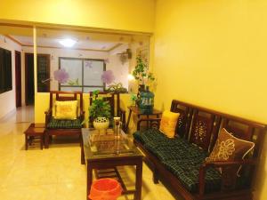 a living room with a couch and a table at Gia Bảo Homestay - Cao Bằng in Cao Bằng