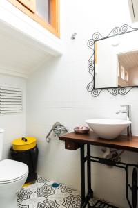 a bathroom with a sink and a toilet at La Villa Gardenia : 4Br Villa with Private Garden in Istanbul