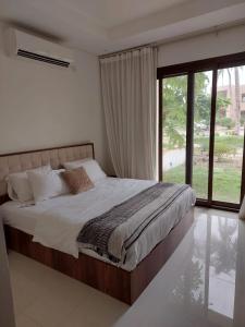Llit o llits en una habitació de Maxim Hawana Salalah