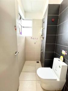 a small bathroom with a toilet and a shower at B1610 Austin Height Crayon shin chan Home By Stay in Johor Bahru