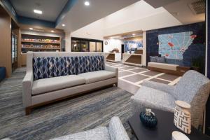 a living room with a couch and chairs at Holiday Inn Express Conway, an IHG Hotel in Conway