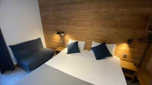 Postel nebo postele na pokoji v ubytování Hotel La Verticale