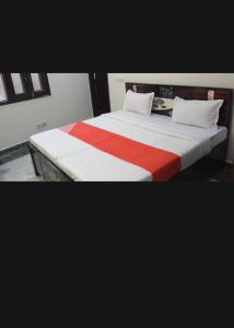 Cama o camas de una habitación en OYO Rajvanshi Hotel & Resort