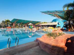 a large swimming pool with a water park at Suannamphukradueng &Suansook Resort in Ban Nong Tum