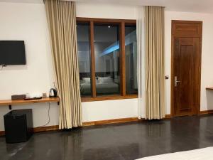 TV a/nebo společenská místnost v ubytování UMA Residence + 23 fotografií