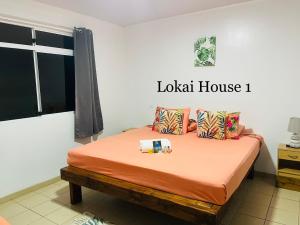 Postel nebo postele na pokoji v ubytování Lokai house