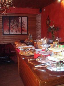 a buffet line with plates of food on it at Enthymio Suites in Synikia Mesi Trikalon