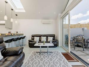 a living room with a couch and a table at 2 Bed in Brixham 90912 in Brixham +14 photos