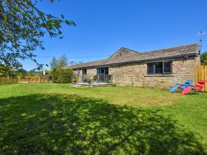 a stone house with a yard in front of it at 2 Bed in Pendle 91032 in Brierfield