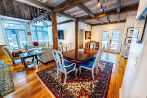 a dining room with a wooden table and chairs at Hit the Slopes! in Intervale