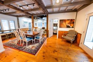 a dining room with a table and chairs at Hit the Slopes! in Intervale