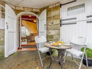 a patio with a table and chairs in front of a building at 3 Bed in Whitby 90810 in Aislaby