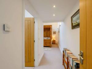 a hallway with a door leading to a bedroom at 1 Bed in Gamblesby 91164 in Kirkoswald