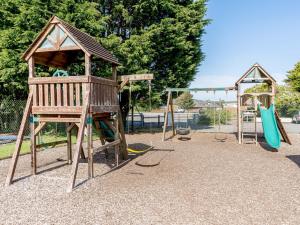 a playground with two swings and a slide at 2 bed in Gower 91222 in Knelston
