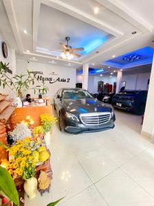 a car dealership with a car parked in a garage at Hanoi Asia 2 Long Bien in Hanoi