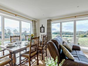 a living room with a couch and a table at 3 Bed in Skendleby 91142 in Skendleby