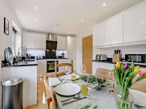 a kitchen and dining room with a table and chairs at 3 Bed in Whitstable 91063 in Whitstable