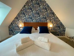Letto o letti in una camera di Hôtel du Musée