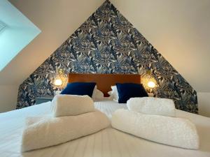 Letto o letti in una camera di Hôtel du Musée