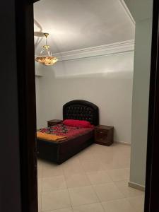 a bedroom with a bed in a room with a ceiling at Holikeys - El Jadida - 2 Ch - Sidi Bouzid 004 in El Jadida