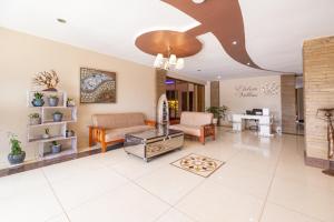 a living room with a couch and a table at Eldon Suites & Apartments in Nairobi