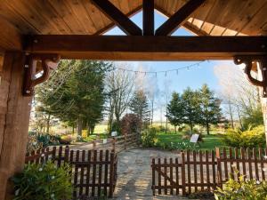 an entrance to a garden with a wooden fence at 1 Bed in Horningtoft 91344 in Whissonsett