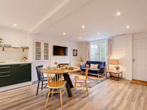 a kitchen and living room with a table and chairs at 2 Bed in Lauder 91383 in Lauder
