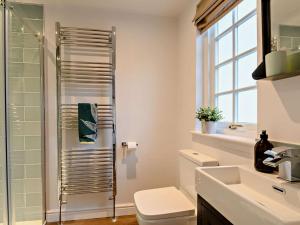 a bathroom with a toilet and a glass shower at 2 Bed in Lauder 91383 in Lauder +7 photos