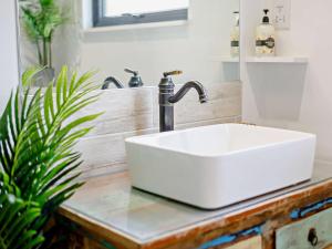 a white sink on a counter in a bathroom at 2 Bed in Whitsand Bay 91328 in Antony +14 photos