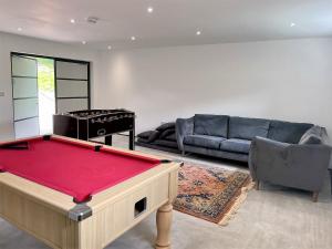 a living room with a pool table and a couch at 4 Bed in Old Churchstoke 91498 in Church Stoke