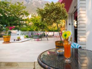 a drink sitting on a table on a patio at Kalkan Suites 103 in Kalkan