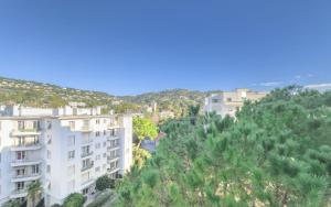a view of a city with trees and buildings at Le Trendy by Winsome Destination in Cannes