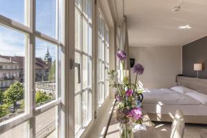 Postel nebo postele na pokoji v ubytování Hôtel de la Rose