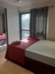 a bedroom with a large bed with a window at Entire 3 bedroom Fully Furnished House, 6 Guests in Suva