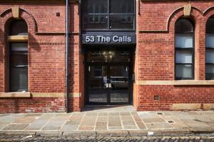 a brick building with a sign that reads the cells at Sleek New York style Apartment in Central Leeds in Leeds