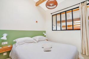 Tempat tidur dalam kamar di Les Nids de la Diane - Appart'Conforts