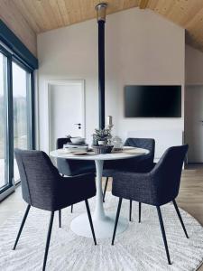 a dining room with a table and chairs at RA House Plitvice Lakes in Bročanac