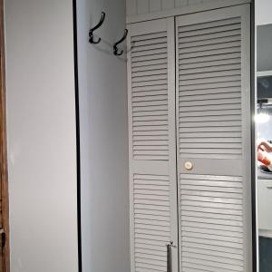 a closet with a door in a kitchen at Apartment on Tytova 8 in Dnipro