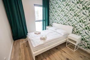 Ένα ή περισσότερα κρεβάτια σε δωμάτιο στο Sosnowy Gaj