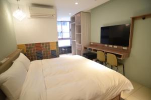 TV a/nebo společenská místnost v ubytování 安平商旅Choona Hotel Anping