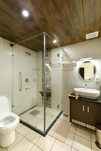 A bathroom at Lhasa Ayurveda and Wellness Resort - A BluSalzz Collection, Kochi, Kerala