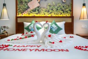 Voodi või voodid majutusasutuse Amina Lantana Hoi An Hotel & Spa toas