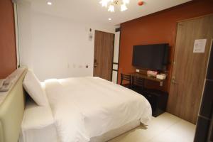TV a/nebo společenská místnost v ubytování 安平商旅Choona Hotel Anping