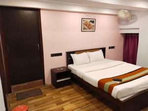 Postel nebo postele na pokoji v ubytování Hotel UCS