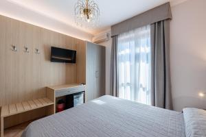 Postel nebo postele na pokoji v ubytování Hotel Romantic + 37 fotografií