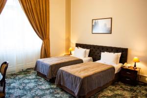 Voodi või voodid majutusasutuse George Hotel toas
