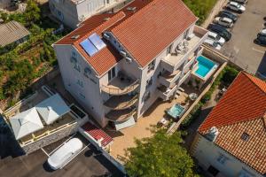 an overhead view of a house with a red roof at Apartments Villa Aura in Dubrovnik